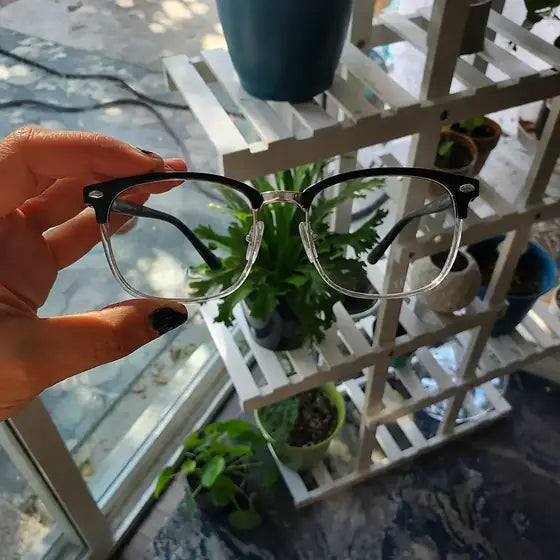 Robert keeps spare blue-light reading glasses near desk and living room